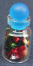 a dolls house miniature sweets in a jar mixed